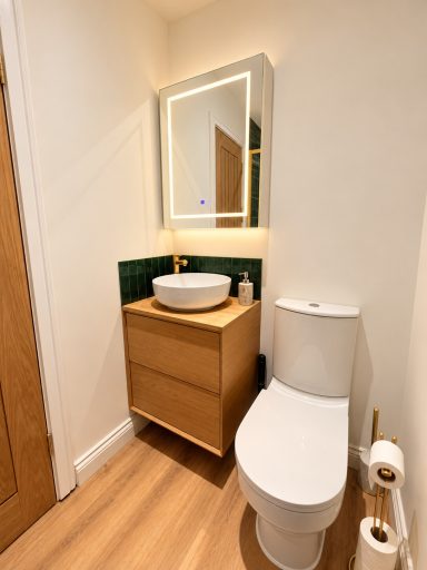 Modern bathroom with vanity and mirror at Cosy Retreats