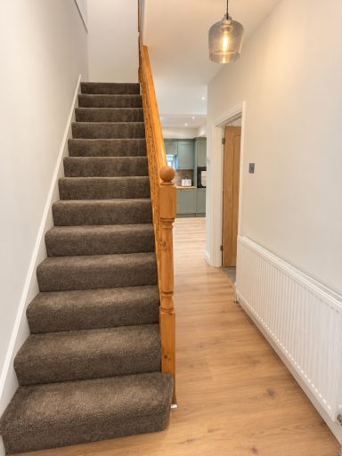 Staircase and hallway at Cosy Retreats holiday home, Maidenhall area, Luton